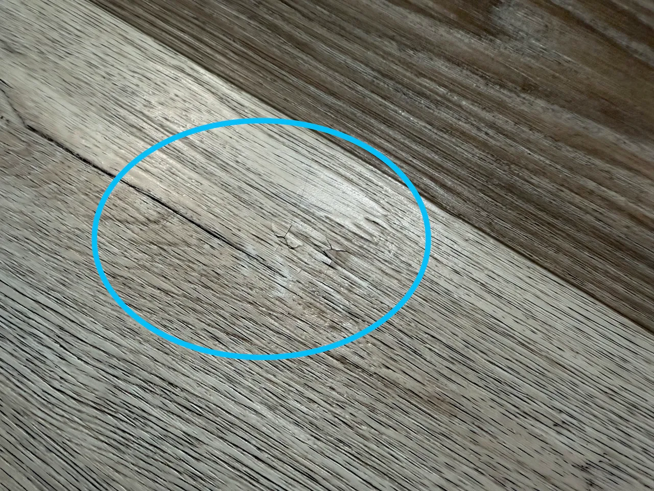 Close-up of cracking damage from nail impact